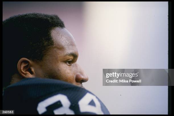 Running back Bo Jackson of the Los Angeles Raiders looks on during a game against the Buffalo Bills at the Los Angeles Memorial Coliseum in Los...