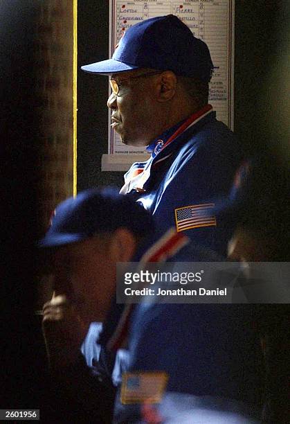 Manager Dusty Baker of the Chicago Cubs watches from the dugout in the seventh inning against the Florida Marlins during game seven of the National...