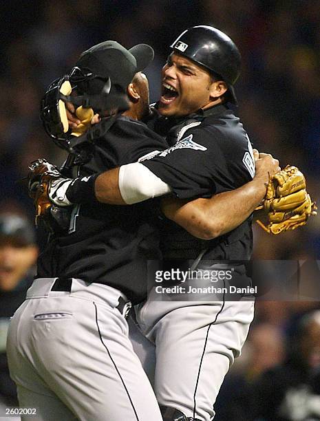 Closer Ugueth Urbina of the Florida Marlins celbrates with catcher Ivan Rodriguez after the final out against the Chicago Cubs during game seven of...