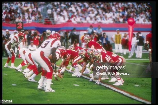 Quarterback Joe Montana of the San Francisco 49ers calls the signals during Super Bowl XXIII against the Cincinnati Bengals at the Joe Robbie Stadium...