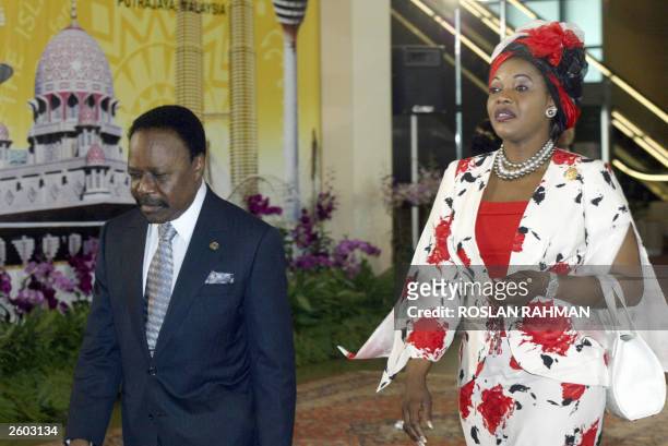 Gabon's President Omar Bongo and his wife, Lucie, arrive at the convention center for the opening of the 10th summit of the Organization of the...