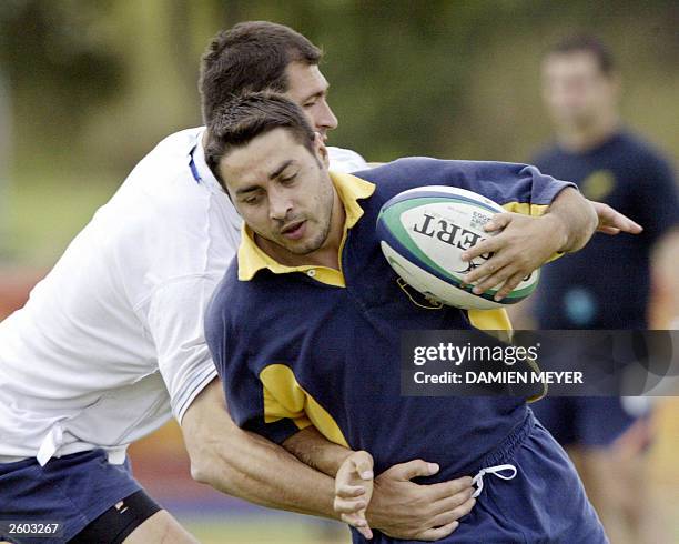 Romanian fullback Iulian Andrei practices at Shaw Sportz field during a training session, in Brisbane 15 October 2003. Romania will meet Australie in...