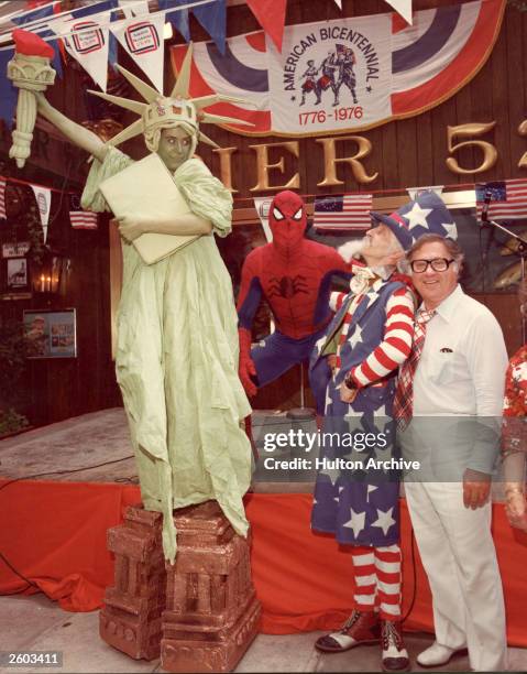 People in costume as the Statue of Liberty, Uncle Sam and Spiderman pose together during the American Bicentennial celebrations, July 1976.