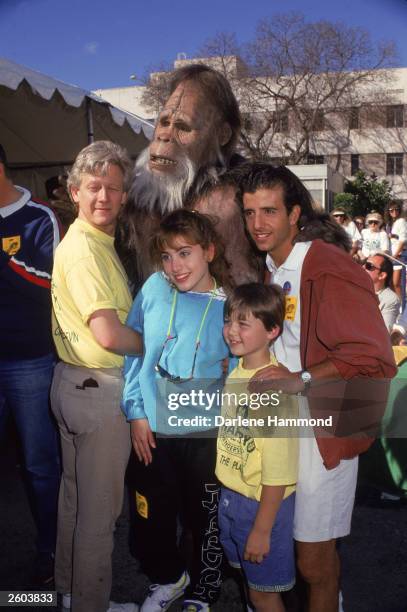 Cast members, including Bruce Davison, Carol-Ann Plante and Zachary Bostrom, from the television series, 'Harry and the Hendersons,' posing outdoors,...