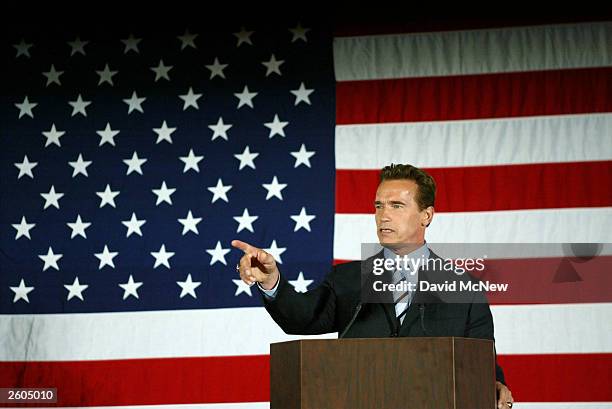 California Governor-elect Arnold Schwarzenegger holds a press conference following his appearance with U.S. President George W. Bush October 16, 2003...