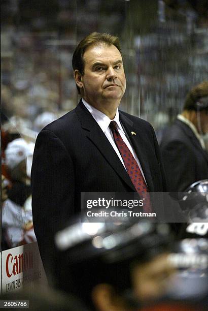 Head coach Pat Burns of the New Jersey Devils keeps an eye on the action against the Toronto Maple Leafs at the Continental Arena on October 16, 2003...