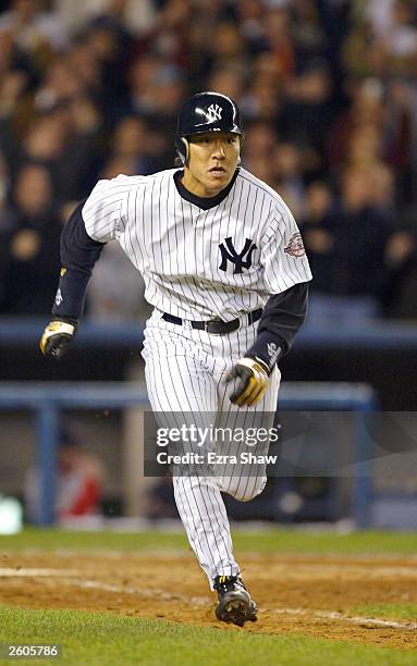 Hideki Matsui of the New York Yankees hits a double against the Boston Red Sox in the eighth inning during game 7 of the American League Championship...