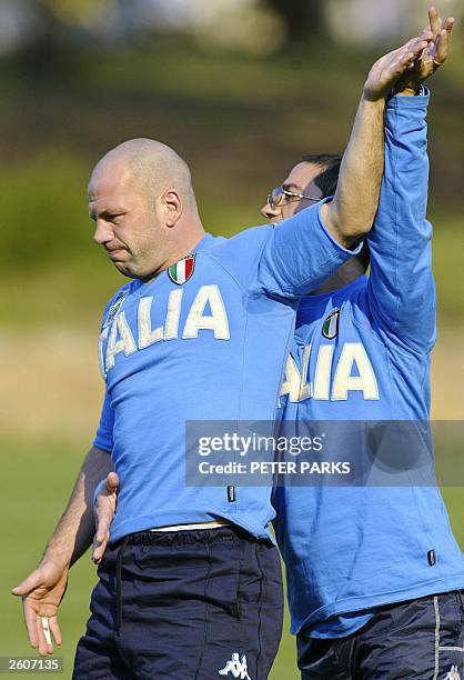 Italian captain Alessandro Troncon recieves treatment from physiotherapist Claudio Fossati during training for the Rugby World Cup 2003 in Canberra,...