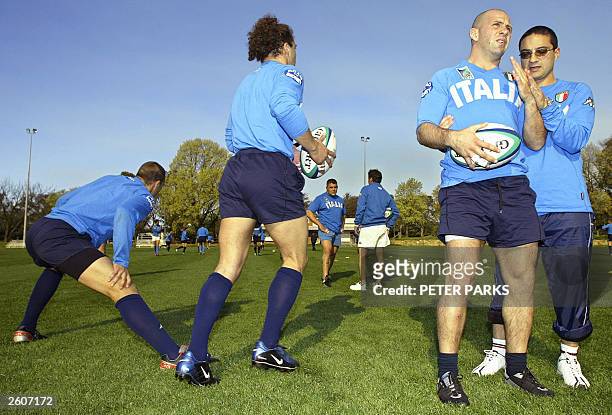 Italian Alessandro Troncon recieves treatment from physiotherapist Claudio Fossati during training for the Rugby World Cup 2003 in Canberra, 17...