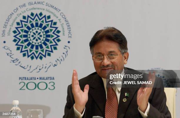 Pakistani President Pervez Musharraf gestures while answering a question during a press conference on the sidelines of the Organisation of the...