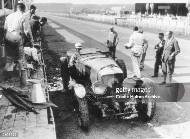 Bentley car pulls into the pits to refuel during the Le Mans race, 1930.