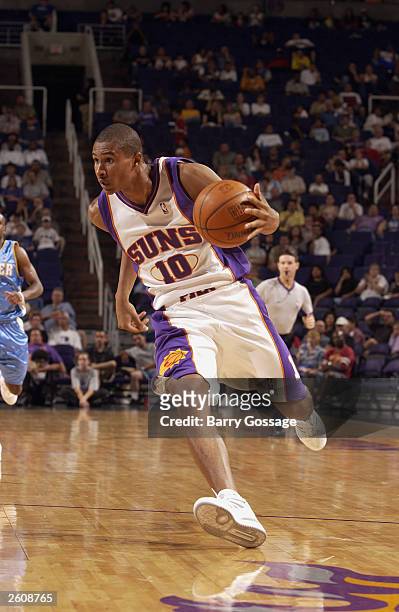 Leandro Barbosa of the Phoenix Suns takes the ball to the basket against the Denver Nuggets during the preseason game at America West Arena on...