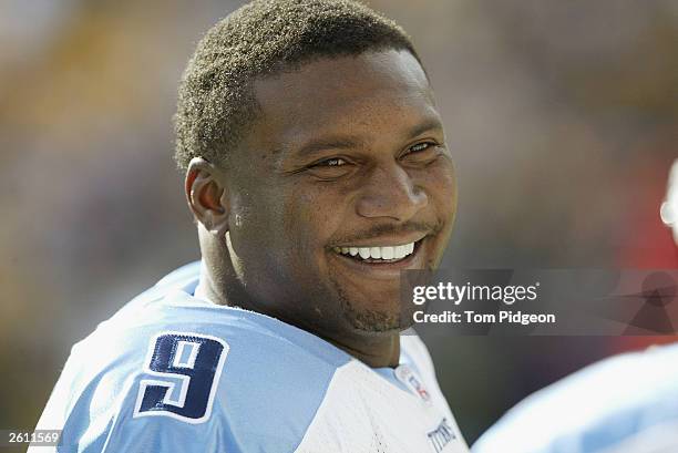 Steve McNair of the Tennessee Titans smiles while talking to a teammate during the game against the Pittsburgh Steelers on September 28, 2003 at...