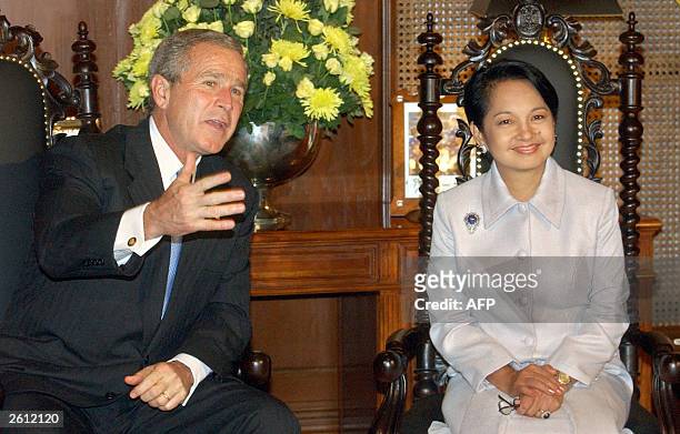 President George W. Bush jokes about the anxious press with Philippine President Gloria Macapagal Arroyo at the beginning of a one on one meeting at...
