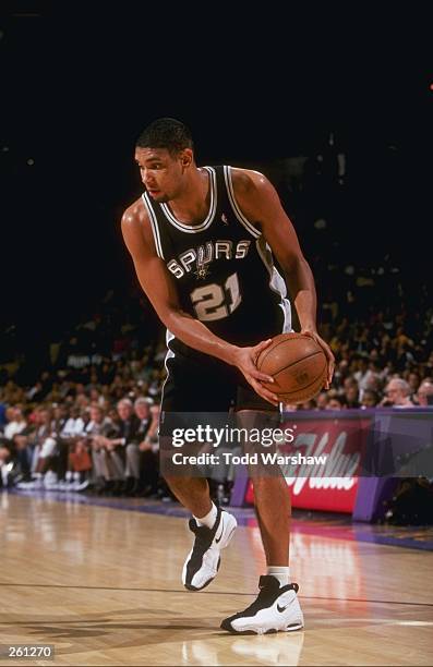 Center Tim Duncan of the San Antonio Spurs moves the ball during a game against the Los Angeles Lakers at the Great Western Forum in Inglewood,...