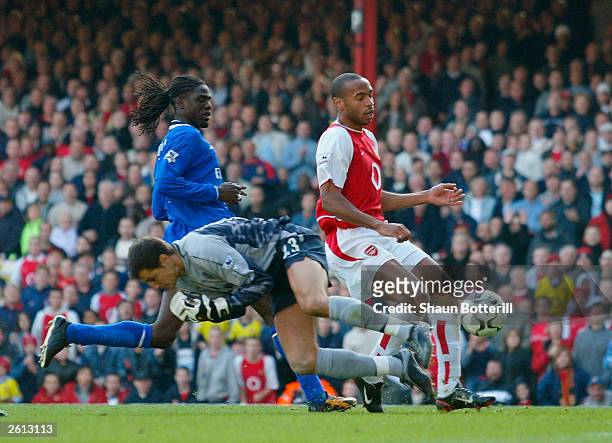 Thierry Henry of Arsenal scores past goalkeeper Carlo Cudicini of Chelsea during the FA Barclaycard Premiership match between Arsenal and Chelsea on...