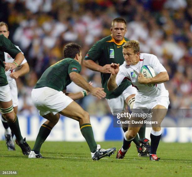 Jonny Wilkinson, of England takes on Joost van der Westhuizen during the Rugby World Cup Pool C match between South Africa and England at Subiaco...