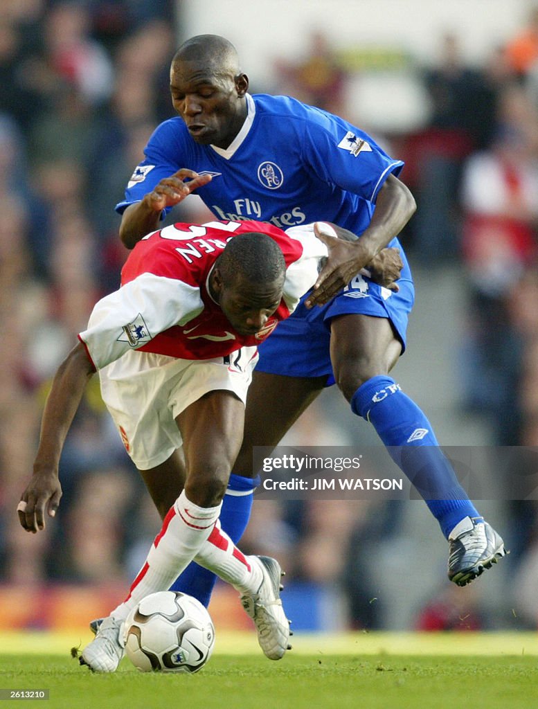 Chelsea's Geremi (rear) vies for the bal