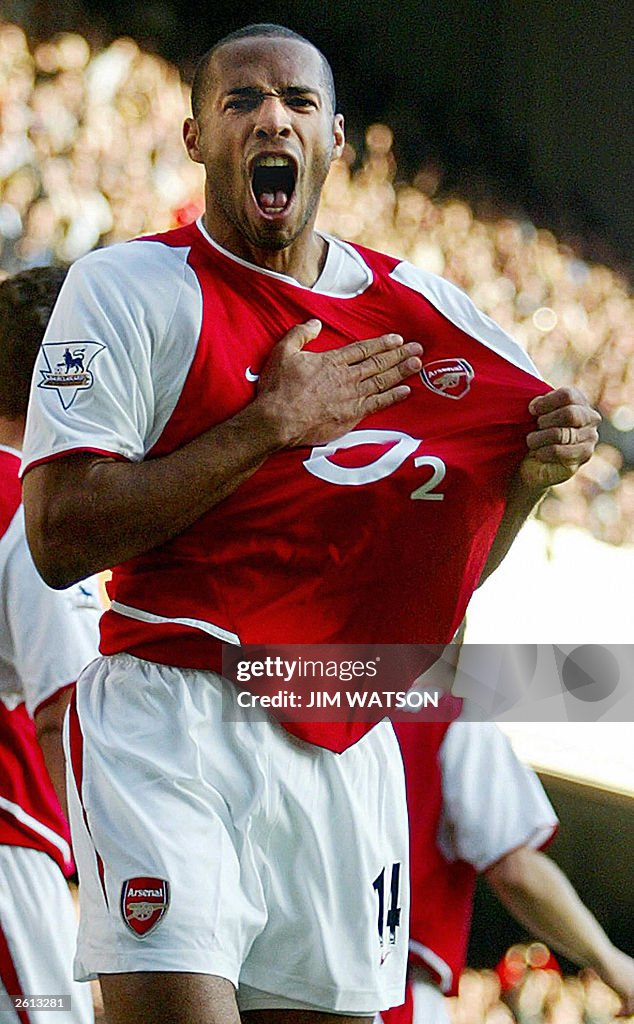 Arsenal's Thierry Henry celebrates after