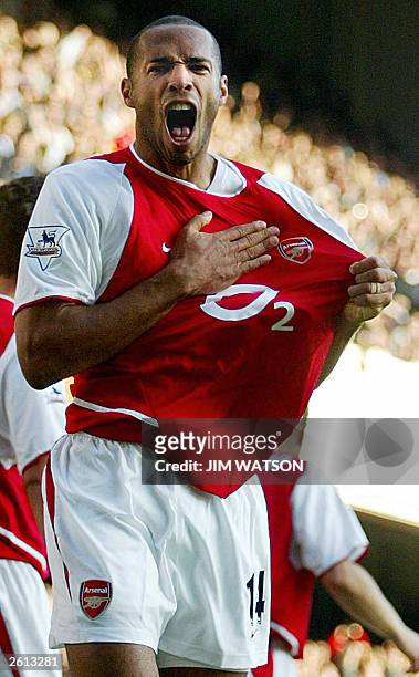 Arsenal's Thierry Henry celebrates after scoring a goal late in the second half against Chelsea at Highbury Stadium in London 18 October 2003....