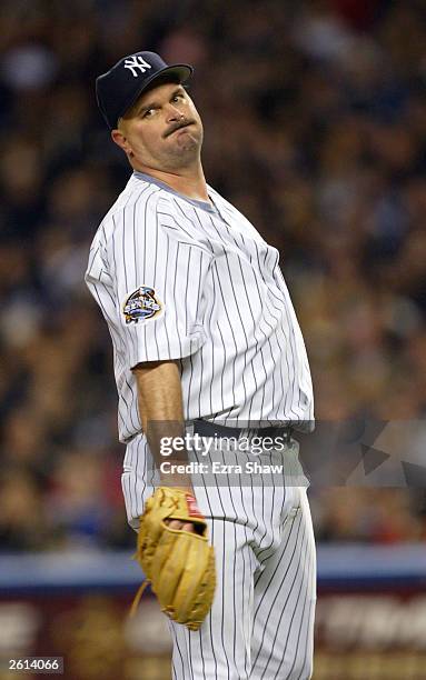 Pitcher David Wells of the New York Yankees reacts after walking Jeff Conine of the Florida Marlins in the seventh inning during game 1 of the Major...