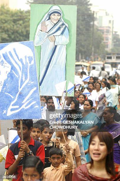 Indian street children take part in a march celebrating the beatification of Mother Teresa through the streets of Calcutta 19 October 2003. Thousands...