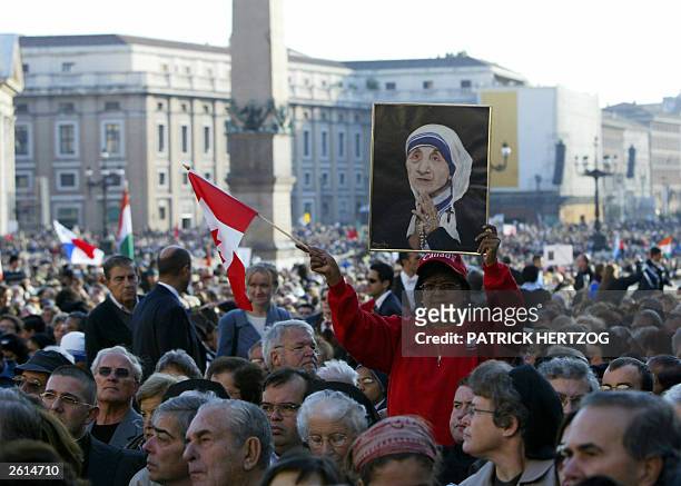 Canadian pilgrim displays a portrait of Mother Teresa asPope John Paul II celebrates the Beatification mass of the Albanian born nun 19 October 2003...