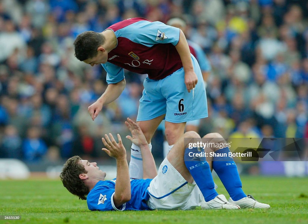 Barry of Aston Villa argues with Dunn of Bham