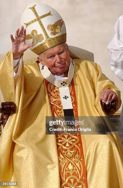 Pope John Paul II gives his blessing to the pilgrims as he arrives to celebrate the beatification ceremony of Mother Teresa in St. Peter's Square...