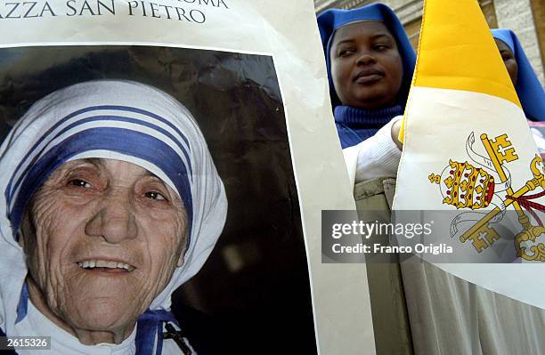 Nuns near the portrait of Mother Teresa during the beatification ceremony led by Pope John Paul II October 19, 2003 in Vatican City, Italy. Mother...