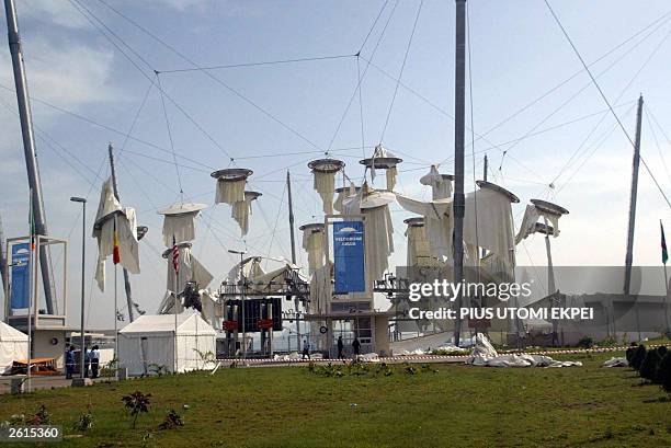 The main entrance to Abuja velodrome is in shreds 19 October, 2003 after it was wrecked by a rain storm before the closing ceremony of the All Africa...