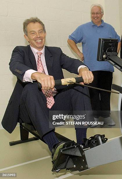 In this file photo, British Prime Minister Tony Blair is put through his paces on a rowing machine during a visit to the cardiac unit at the Royal...