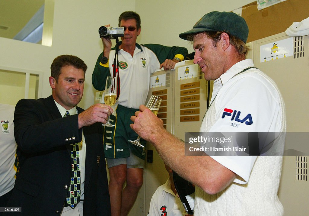 Matthew Hayden of Australia is congratulated by former Australian player Mark Taylor after scoring 380 to break Brian Lara of The West Indies world record of 375