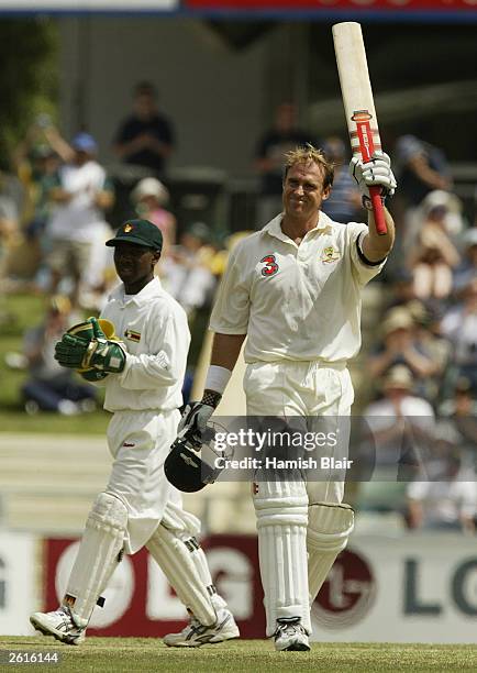 Matthew Hayden of Australia reaches 200 during day two of the First Test between Australia and Zimbabwe played at the WACA Ground on October 10, 2003...