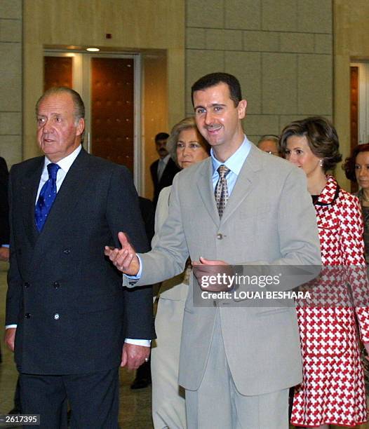 Syrian President Bashar al-Assad and his wife Asma receive King Juan Carlos and Queen Sofia of Spain at al-Shaab Palace, in Damascus 20 October 2003....