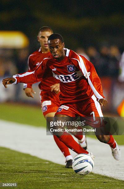 Forward DaMarcus Beasley of the Chicago Fire heads upfield with the ball as teammate Chris Armas trails during a game against the Los Angeles Galaxy...