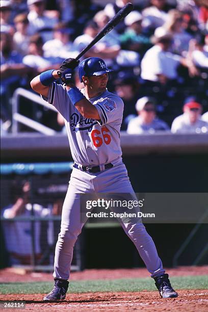 Paul Konerko of the Los Angeles Dodgers bats during their spring training game against the Arizona Cardinals at Roger Dean stadium in Jupiter,...