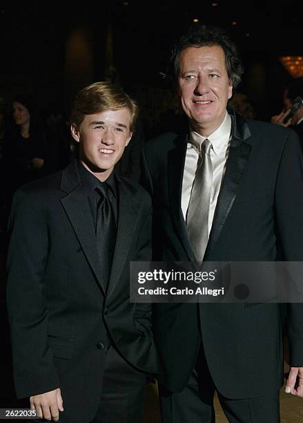 Actors Haley Joel Osment and Geoffrey Rush attend the Hollywood Awards Gala Ceremony at the Beverly Hilton Hotel, October 20, 2003 in Beverly Hills,...