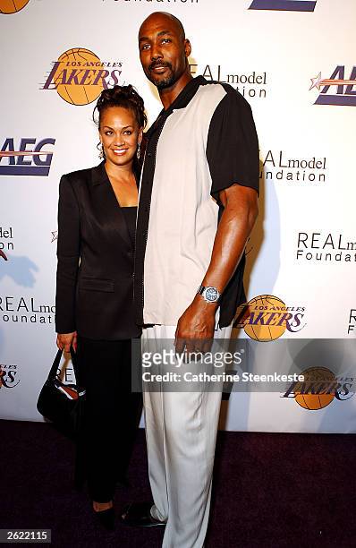 Karl Malone of the Los Angeles Lakers and his wife Kay arriving at the Shaq hosting a night of pre-season party to benefit the Lakers Youth...