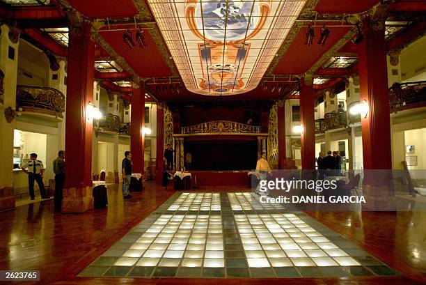 Cleaning and maintenance personnel add the finishing touches to the ballroom at the Arts and Spectacles Center "Piazzola Tango", 20 October 2003 in...