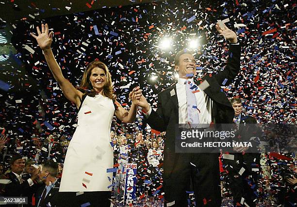 The newly elected Governor of California Arnold Schwarzenegge and his wife Maria Shriver waves to his supporters after delivering a victory speech at...