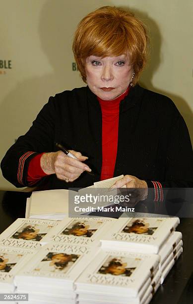 Actress Shirley Maclaine signs copies of her new book 'Out on a Leash' at Barnes and Nobles, Rockefeller Centre on October 21, 2003 in New York City.