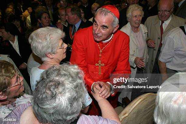 Cardinal Keith Michael Patrick O'Brien of Scotland, Archbishop of St. Andrews and Edinburgh, greets his faithful during a reception for relatives and...
