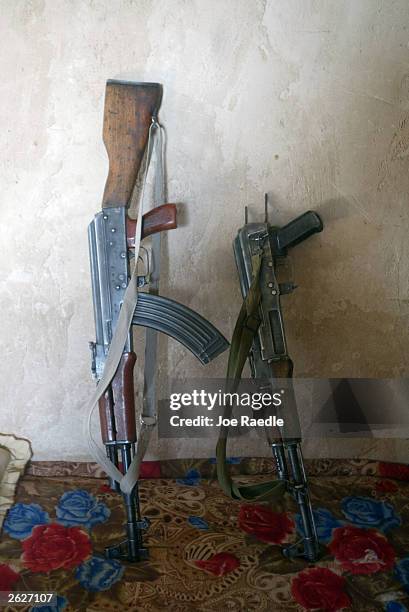 Two AK-47 rifles found by the U.S. Army soldiers from the 720 Military Police Battalion attached to the 4th Infantry Division are seen during a raid...