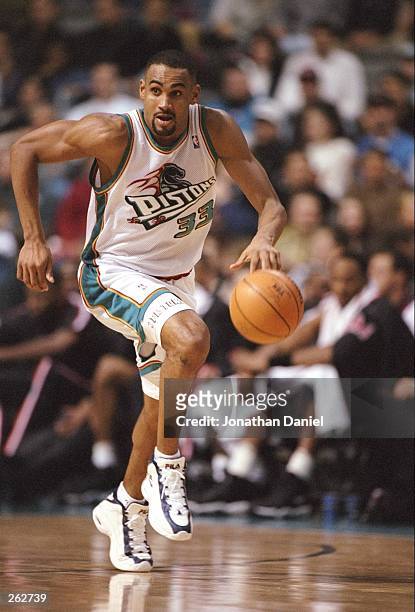 Forward Grant Hill of the Detroit Pistons moves the ball during a game against the Miami Heat at the Palace of Auburn Hills in Auburn Hills,...