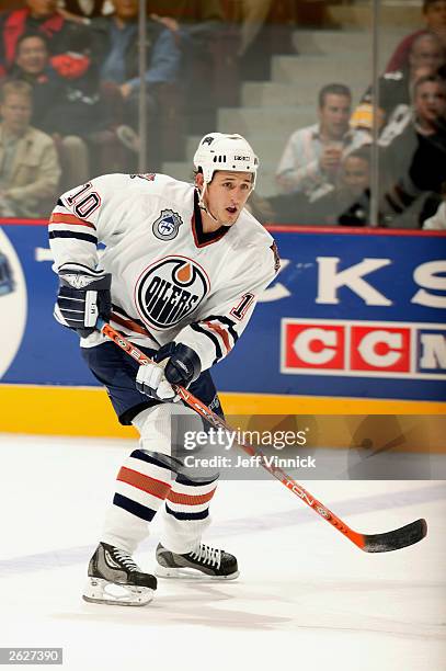 Center Shawn Horcoff of the Edmonton Oilers looks for a pass against the Vancouver Canucks during the NHL game on October 11, 2003 at General Motors...