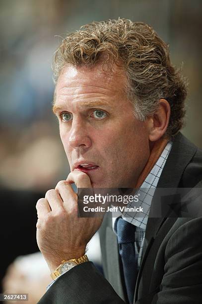 Head Coach Craig MacTavish of the Edmonton Oilers looks on against the Vancouver Canucks during the NHL game on October 11, 2003 at General Motors...