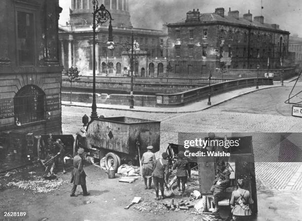 Pro-treaty Free State soldiers use British artillery to attack the anti-Treaty Republican army who established their headquarters in the Four Courts...