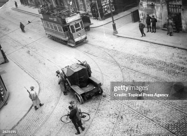 British forces keep order in the streets of Dublin with Rolls Royce armoured Crossley tenders.