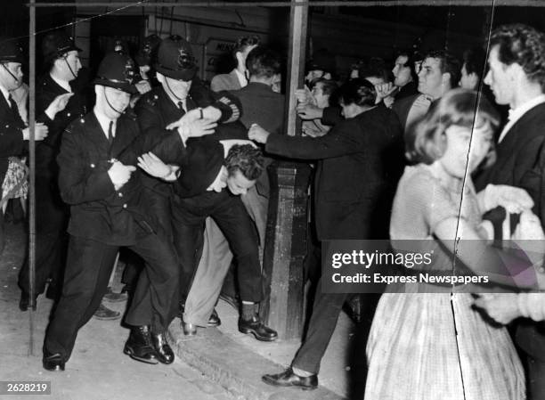 White youth clash with British police during the Notting Hill race riots in London.